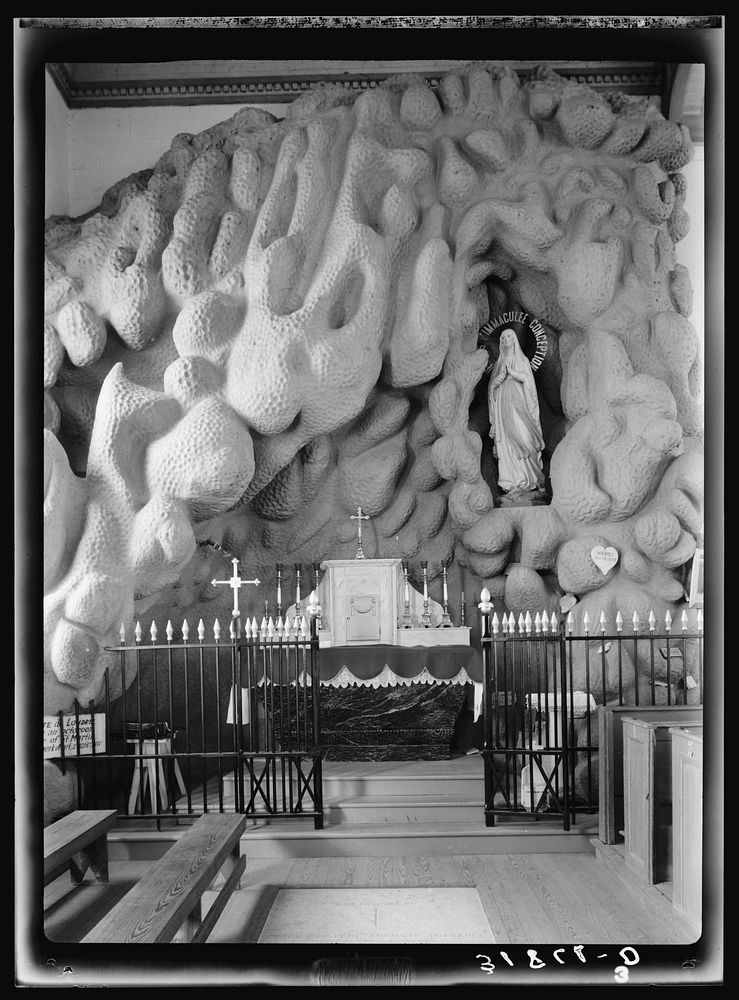 Grotto in church. Saint Martinville, Louisiana. Sculpture work was done by local  by Russell Lee