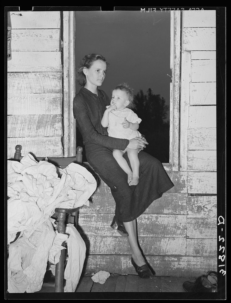 Daughters of the Allen family near Morganza, Louisiana, sitting in the window by Russell Lee