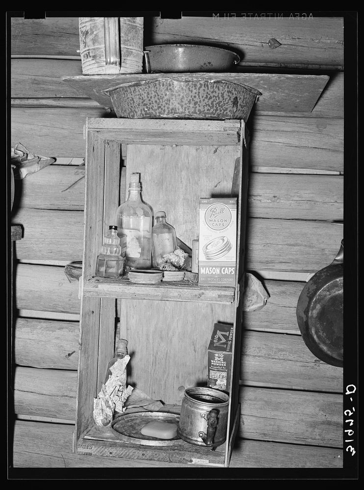 Kitchen cabinet in corncrib home of Mot Tucker. Antioch, Mississippi by Russell Lee