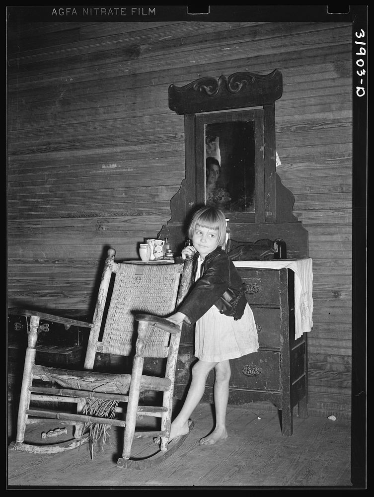 A child of Scarbrough's in front of dresser. Laurel, Mississippi by Russell Lee