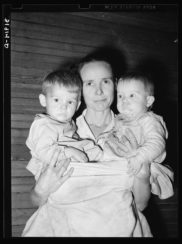 [Untitled photo, possibly related to: Mrs. Scarbrough with two youngest children. Laurel, Mississippi] by Russell Lee
