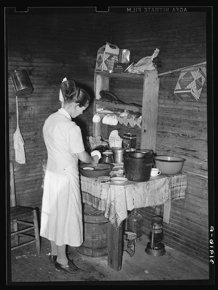 Mrs. Scarbrough in corner of kitchen. Laurel, Mississippi by Russell Lee