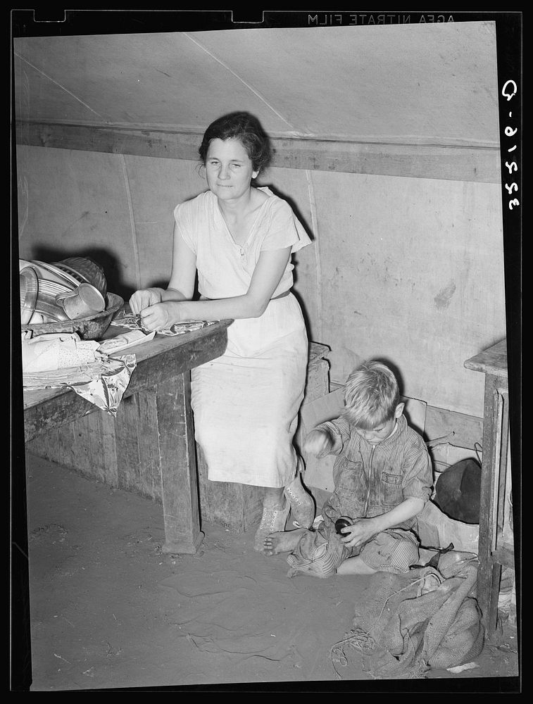 [Untitled photo, possibly related to: White migrant mother and son in tent home near Harlingen, Texas. See 32108-D] by…