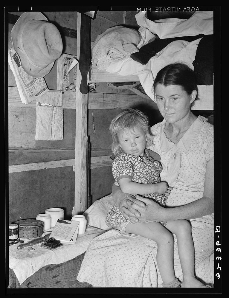 Mother and child, white migrants, in trailer home near Edinburg, Texas by Russell Lee