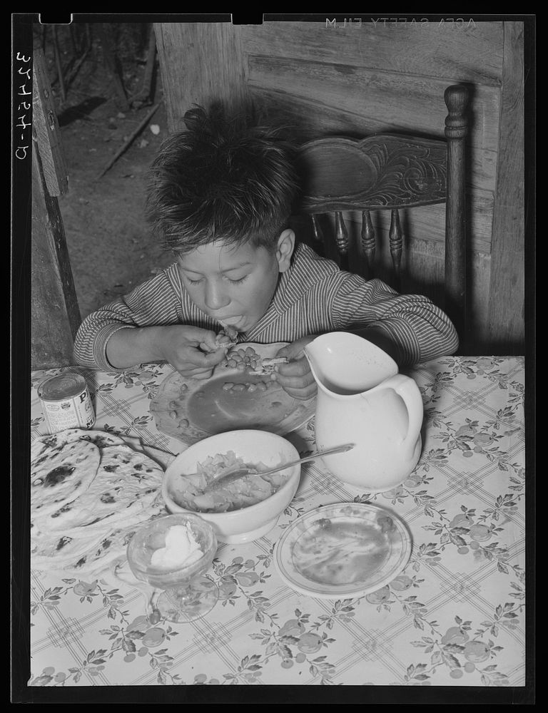 Mexican boy eating lunch. San Antonio, Texas by Russell Lee