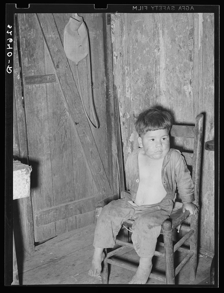 Mexican boy in corner of room. San Antonio, Texas by Russell Lee