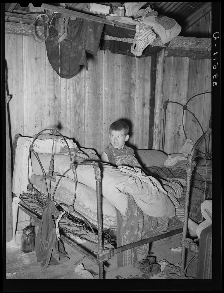 Corner of bedroom of home of agricultural day laborer. McIntosh County, Oklahoma by Russell Lee