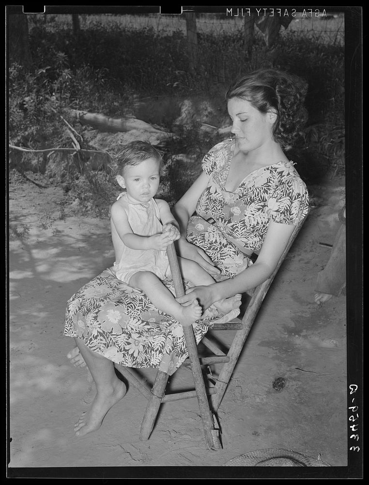 Wife of WPA (Works Progress Administration/Work Projects Administration) worker and her child who live in the Arkansas River…