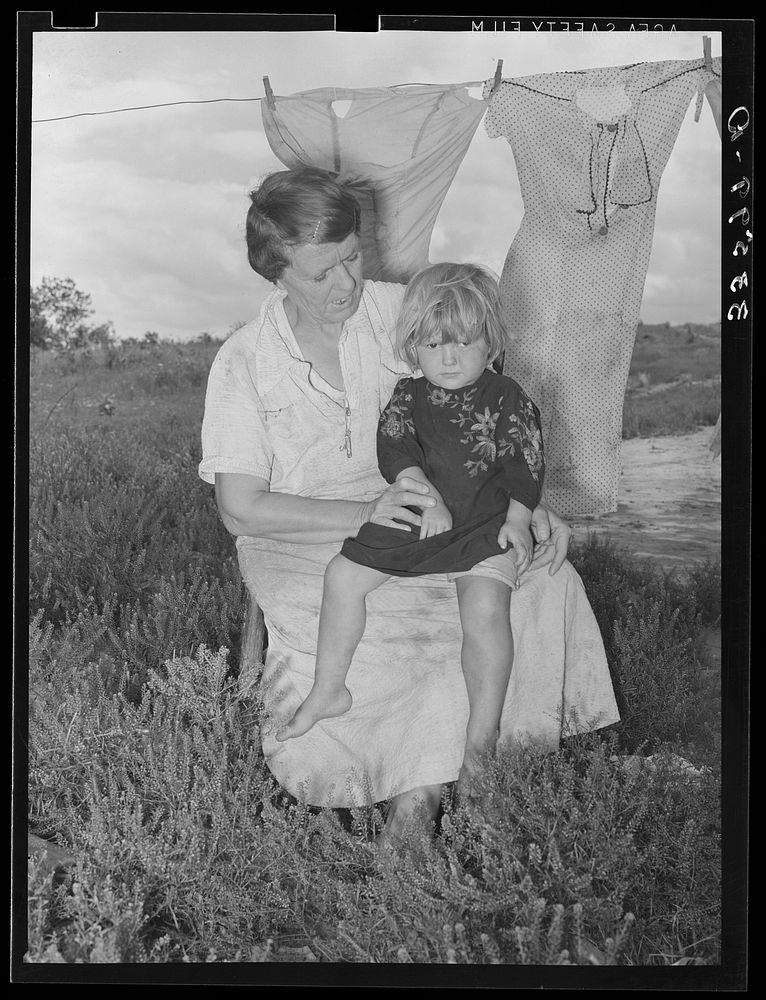 Woman living with agricultural day laborer's family who cared for his wife and two children. Poteau Creek near Spiro…