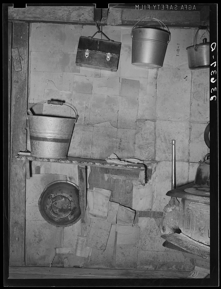 Detail of kitchen of home of  agricultural day laborer in Arkansas River bottoms. Near Vian, Oklahoma by Russell Lee