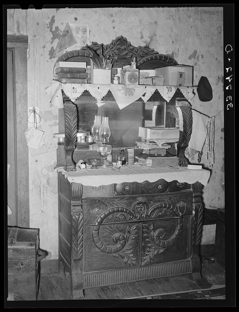 Dresser in home of  agricultural day laborer living in small town in Muskogee County, Oklahoma by Russell Lee