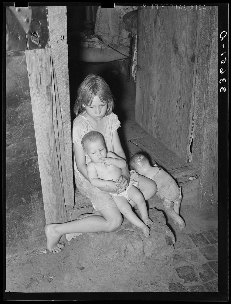 Children of agricultural day laborer in doorway of home near Tullahassee, Oklahoma. Wagoner County by Russell Lee