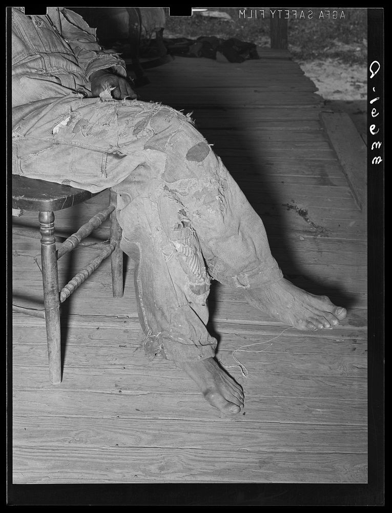 Detail of clothing of tenant farmer. Wagoner County, Oklahoma by Russell Lee