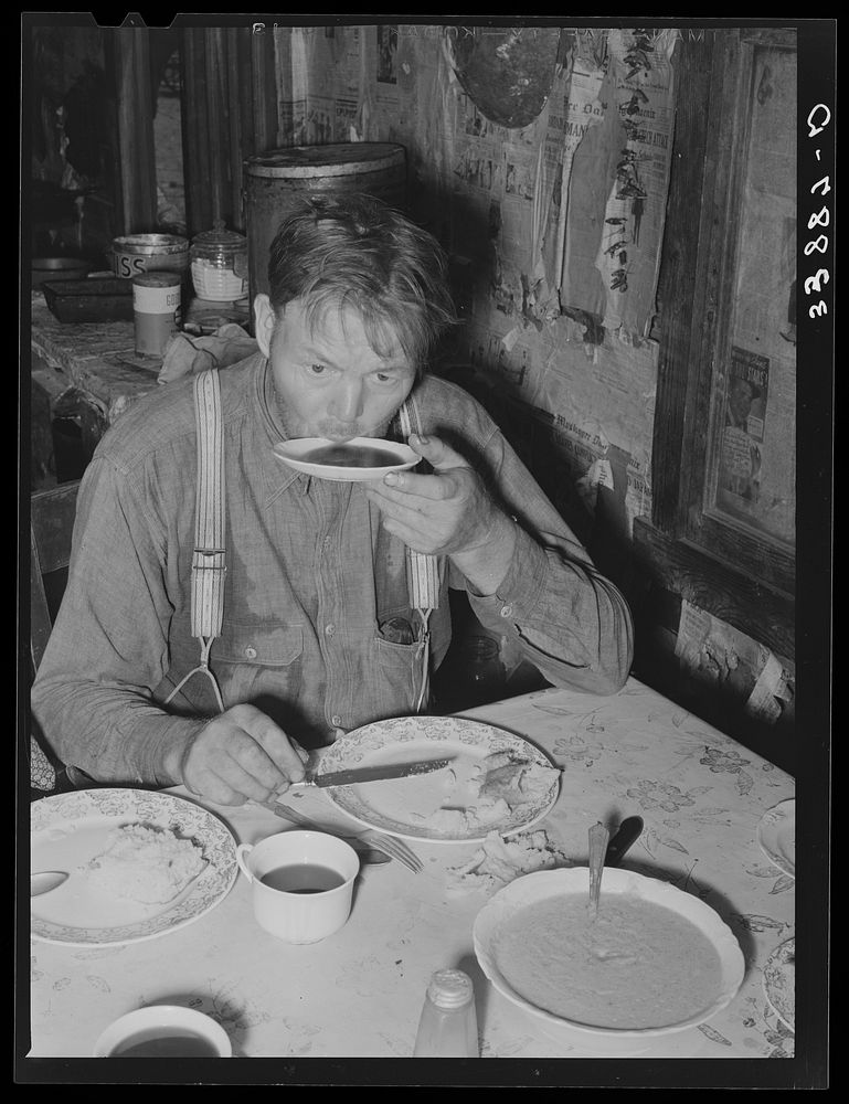 Tenant farmer drinking coffee at noonday meal. Near Muskogee, Oklahoma. See general caption number 20 by Russell Lee