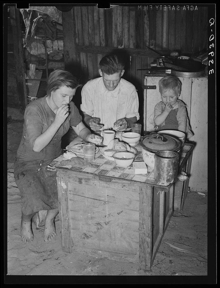 Family eating breakfast. Mays Avenue camp, Oklahoma City, Oklahoma. See general caption no. 21 by Russell Lee