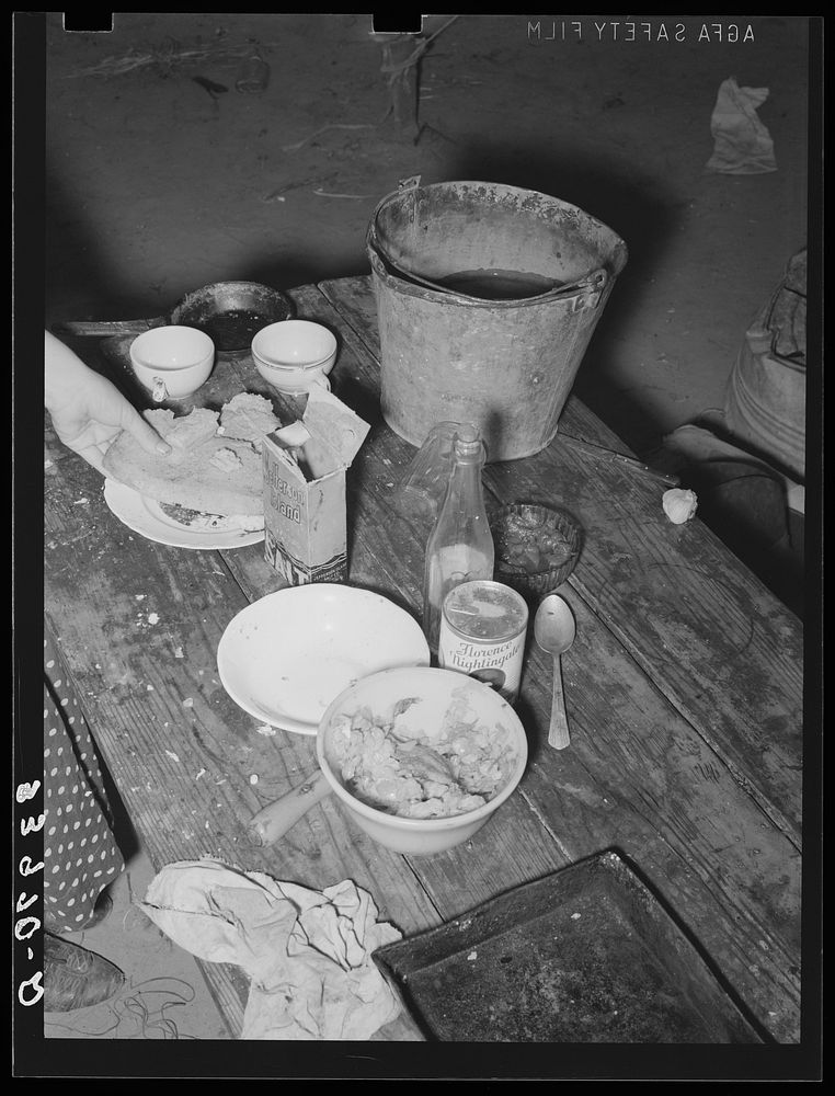 Food on table in community camp. Oklahoma City, Oklahoma. See general caption 21 by Russell Lee