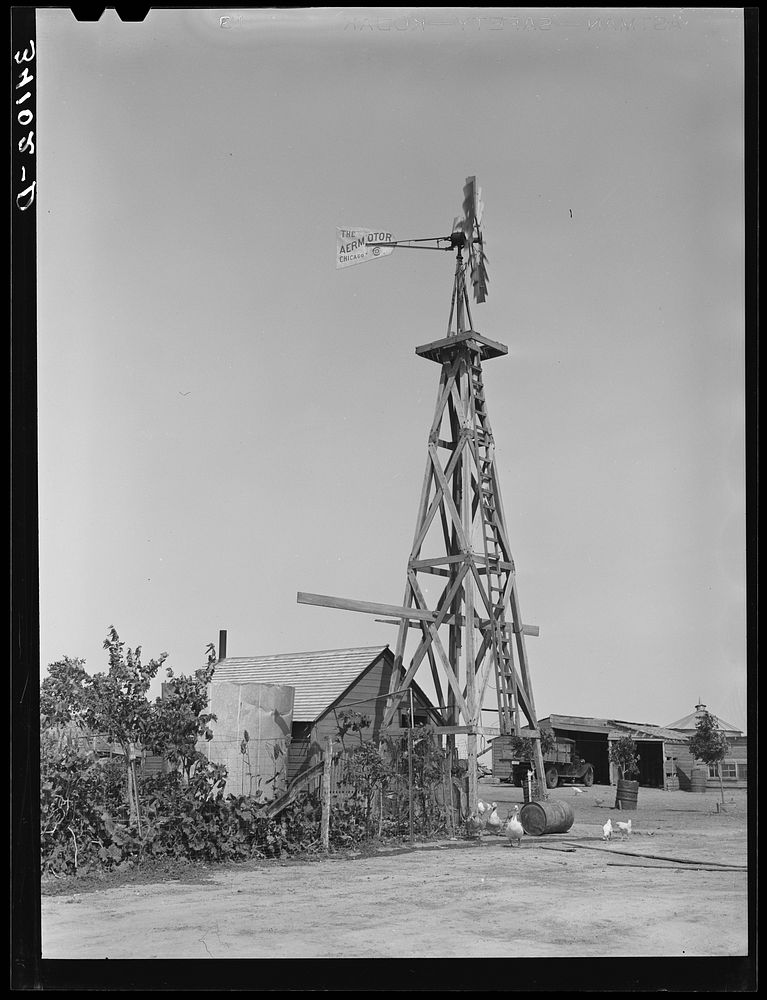 Windmill on farm of William Rall, FSA (Farm Security Administration) client in Sheridan County, Kansas by Russell Lee