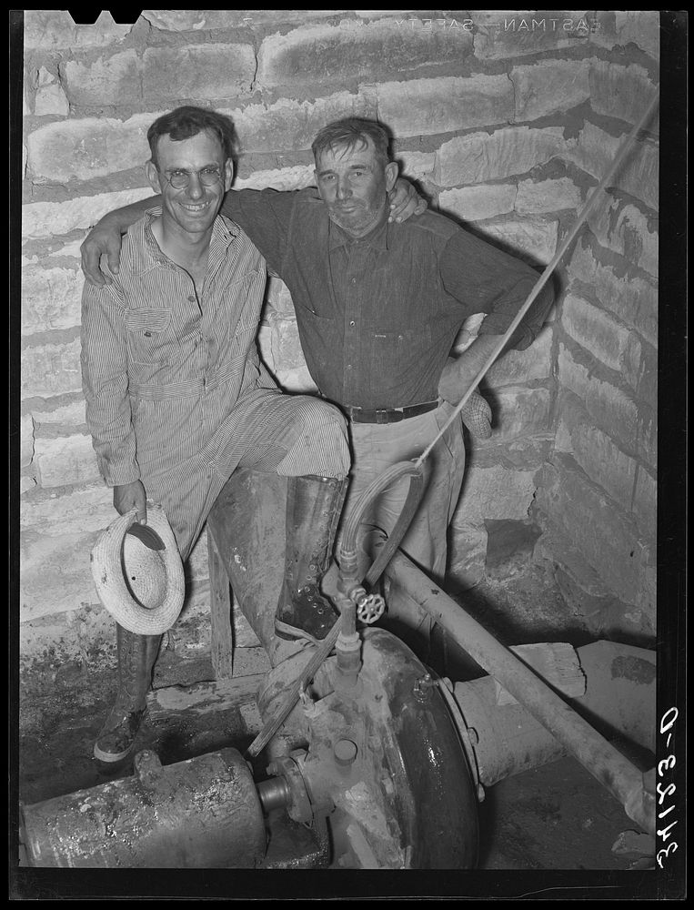 Mr. Johnson and Mr. Wright, owners and cooperators in irrigation well on farm near Syracuse, Kansas. They are FSA (Farm…