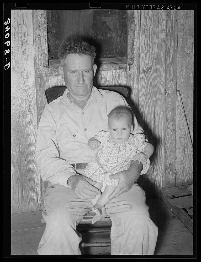 Unemployed oil worker and his baby. Seminole, Oklahoma by Russell Lee