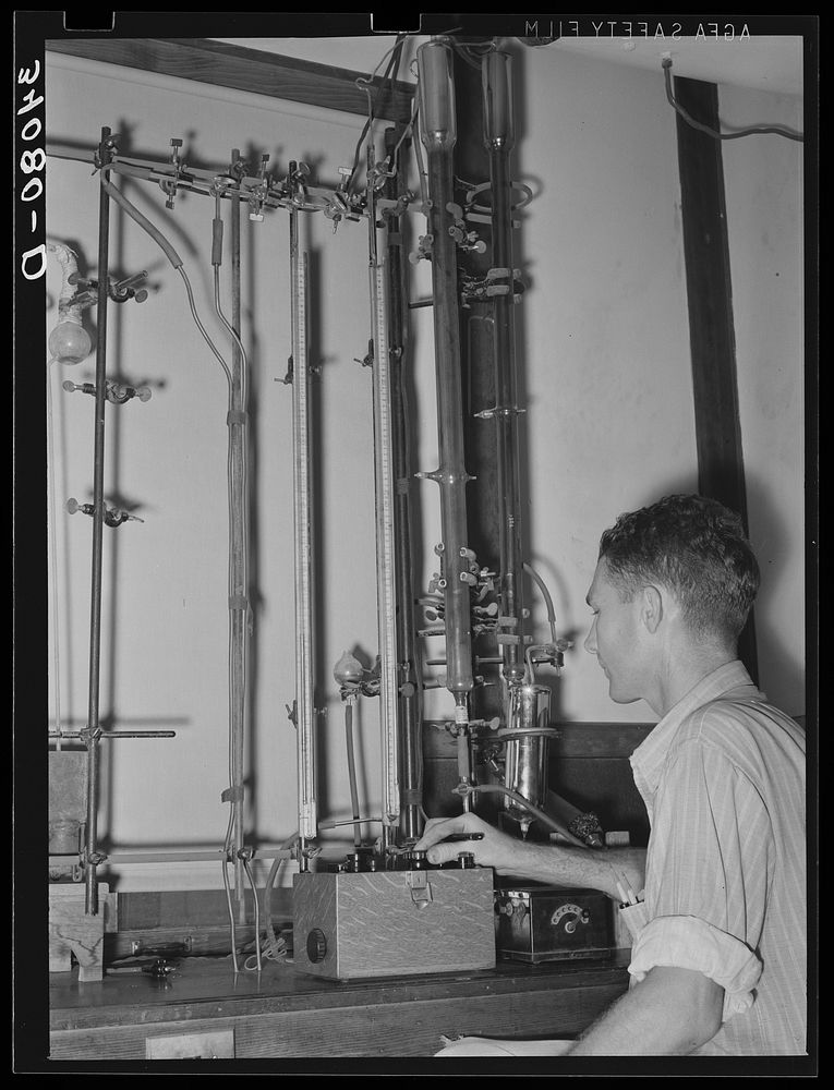 Oil refinery chemist conducting analysis. Seminole, Oklahoma by Russell Lee