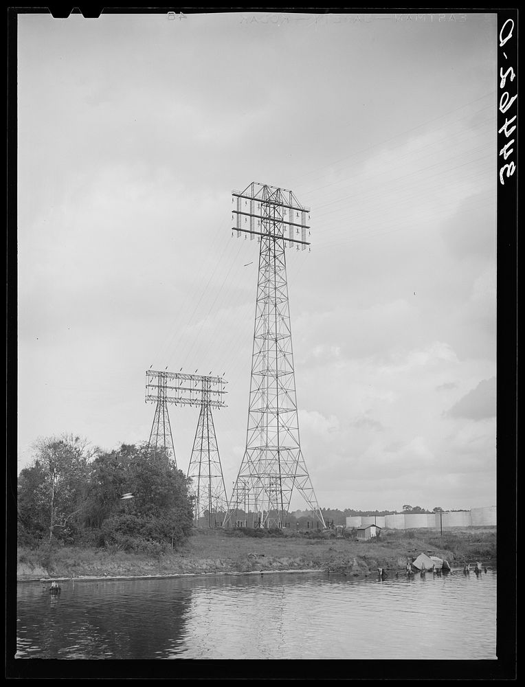 Power lines which cross the channel of the port of Houston, Texas by Russell Lee