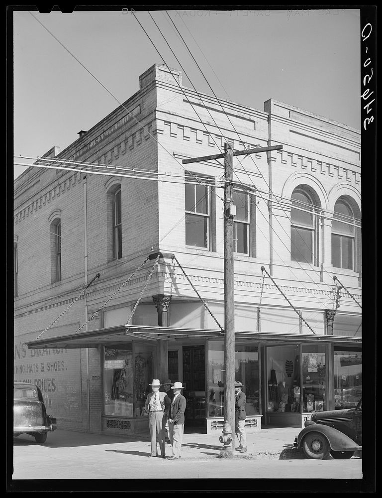 [Untitled photo, possibly related to: Street corner. Gonzales, Texas] by Russell Lee