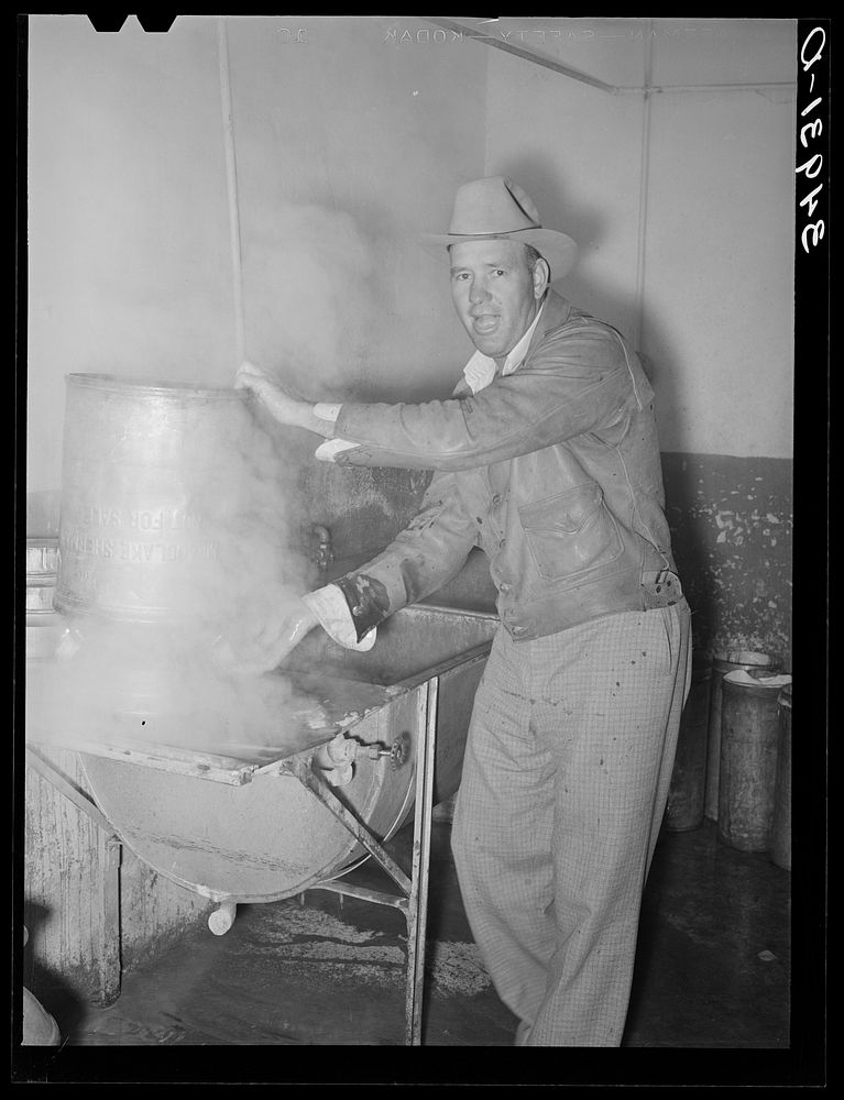 Farmer steaming his milk cans before taking them home. Creamery, San Angelo, Texas by Russell Lee