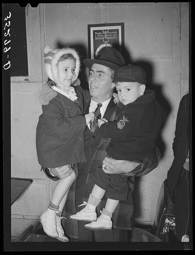 Farmer with his two children at pie supper in Muskogee County, Oklahoma. See general caption number 24 by Russell Lee