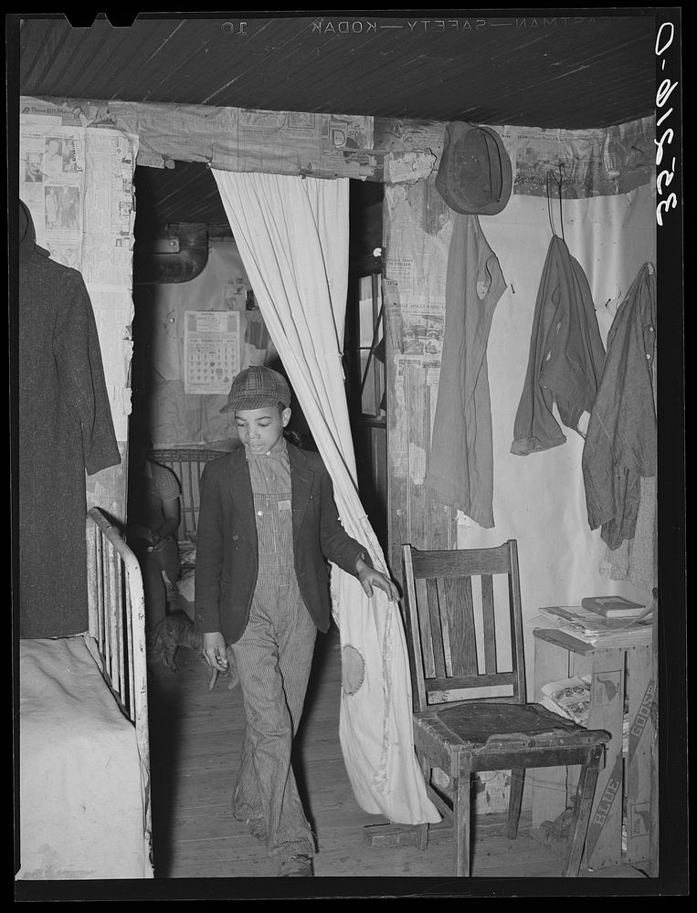Son of Pomp Hall,  tenant farmer, coming through doorway in his house. Creek County, Oklahoma. See general caption number 23…
