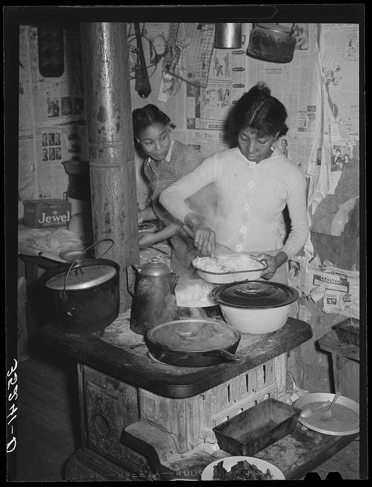 Wife and daughter of Pomp Hall, tenant farmer, dishing up supper. Creek County, Oklahoma. See general caption number 23 by…