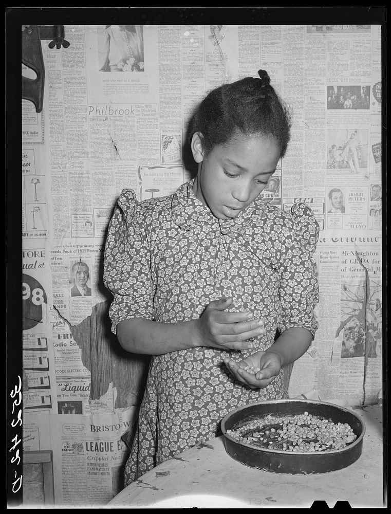 Daughter of Pomp Hall,  tenant farmer, picking over peas for supper. Creek County, Oklahoma. See general caption number 23…