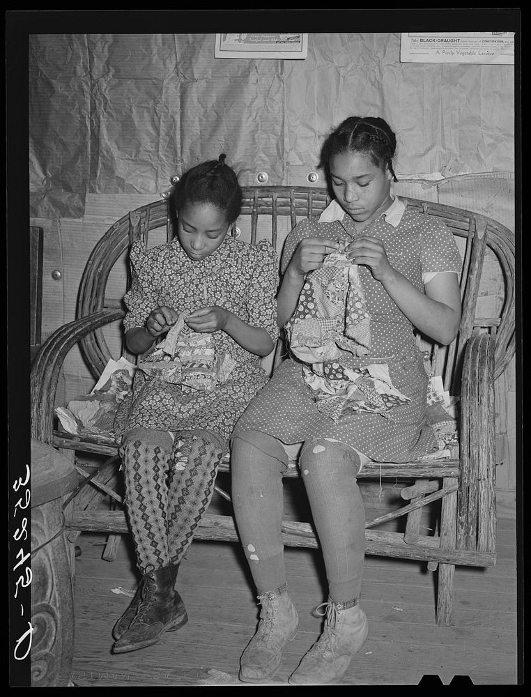 Two daughters of Pomp Hall,  tenant farmer, making patchwork cushions for chairs. Creek County, Oklahoma. See general…