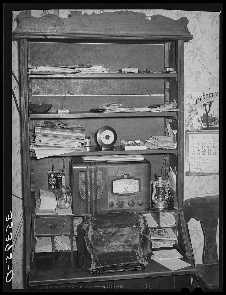 Cabinet and desk of farmer. McIntosh County, Oklahoma by Russell Lee