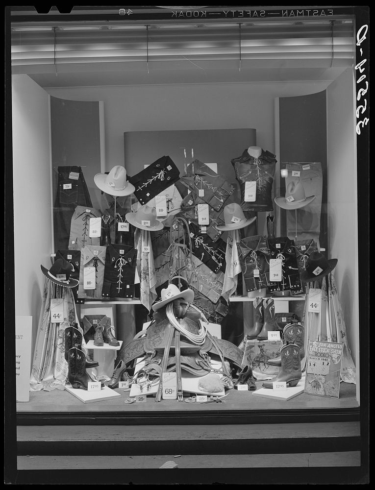 Show window in department store in San Angelo, Texas, during the San Angelo Fat Stock Show. Townspeople adopt rodeo and…