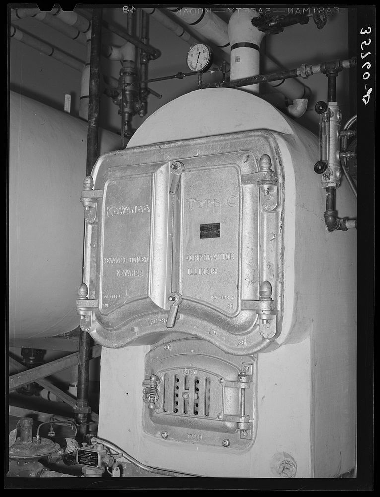 Boiler in the furnace room. Migratory labor camp, Sinton, Texas by Russell Lee