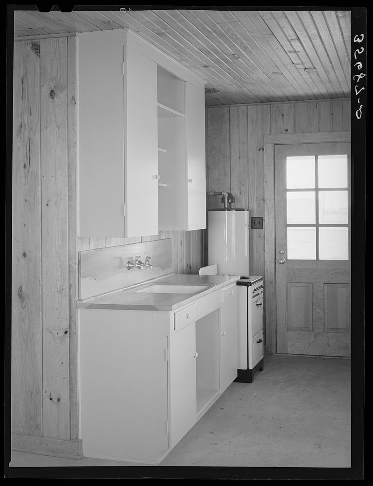Detail of kitchen in house for permanent agricultural workers at the migratory labor camp. Robstown, Texas by Russell Lee