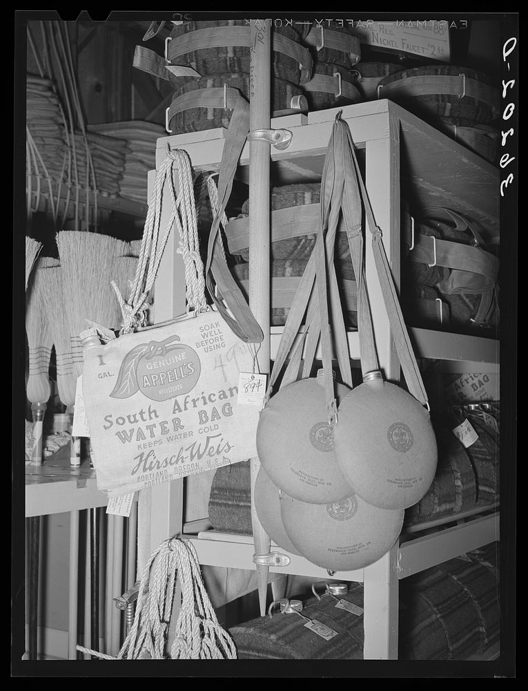 Water bags and canteens, necessities in the arid Southwest, on sale at the United Producers and Consumers Cooperative.…