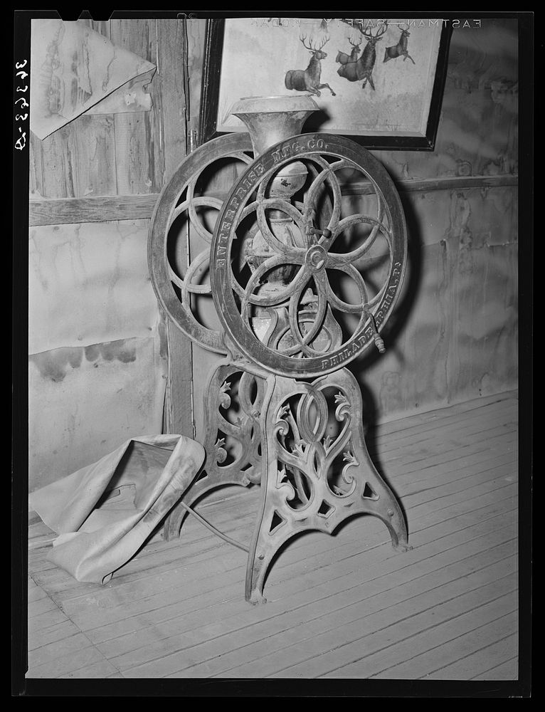 Coffee mill on display at the Bird Cage Theater museum in Tombstone, Arizona by Russell Lee