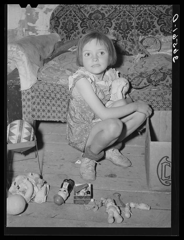 Josie Caudill with her toys. Pie Town, New Mexico by Russell Lee