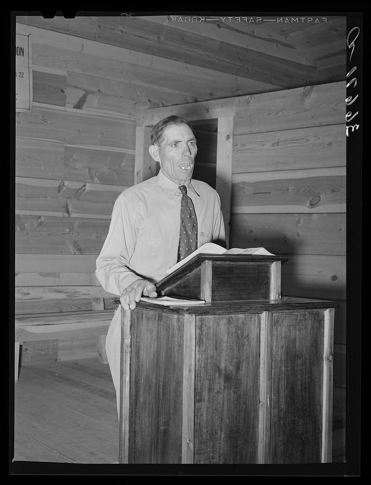 Mr. Leatherman, homesteader from Texas, leading the singing at church services. Pie Town, New Mexico by Russell Lee