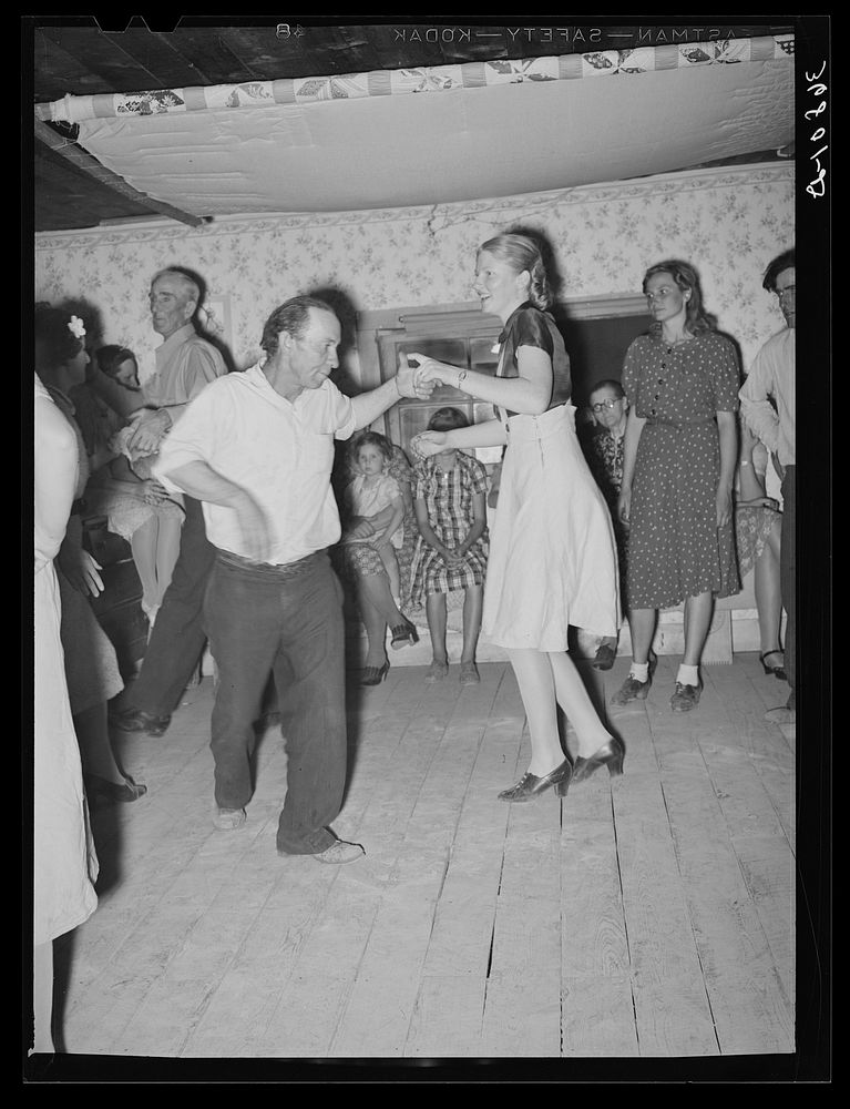 "Swing your partner" figure in a square dance at Pie Town, New Mexico by Russell Lee
