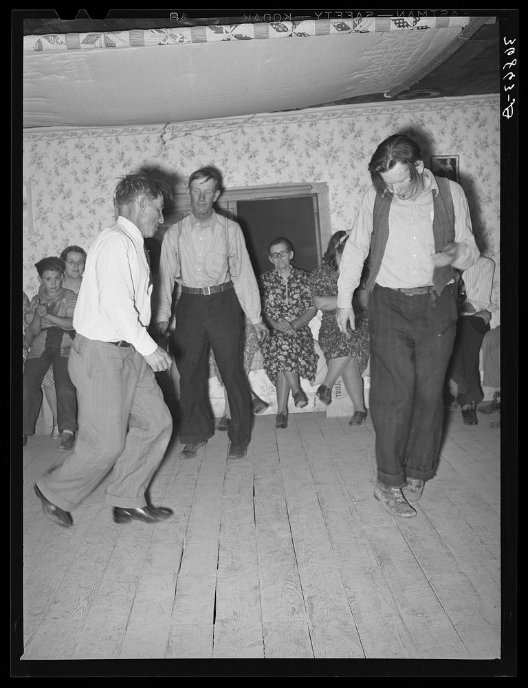 4:30 a.m. and three jiggers do their stuff. Square dance, Pie Town, New Mexico by Russell Lee