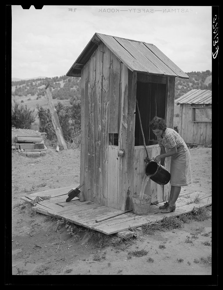 Covered well on Spanish-American family. Chamisal, New Mexico by Russell Lee