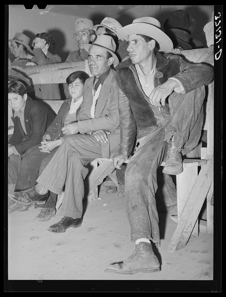 Spanish-American farmers watching show. Penasco, New Mexico by Russell Lee