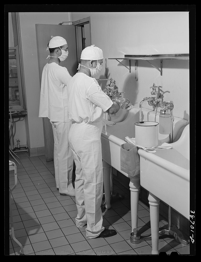 Doctors at hospital scrubbing up. Chicago, Illinois by Russell Lee
