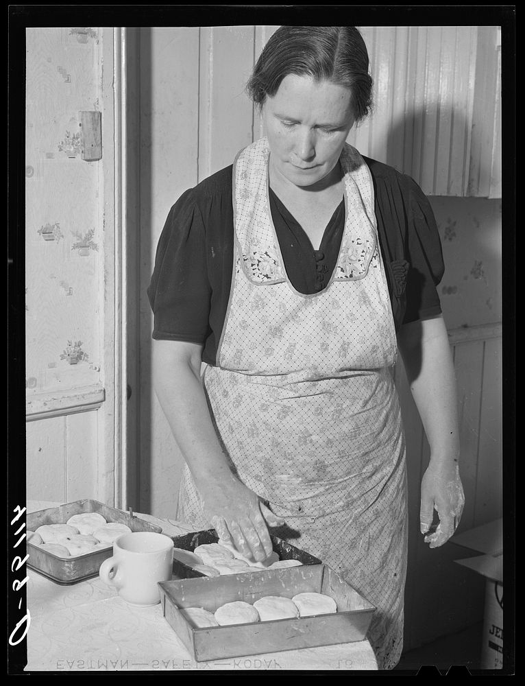 Mrs. Ralph Reitz, member of Tri-County Farmers Co-op Market at Du Bois, Pennsylvania, preparing baked goods for market at…