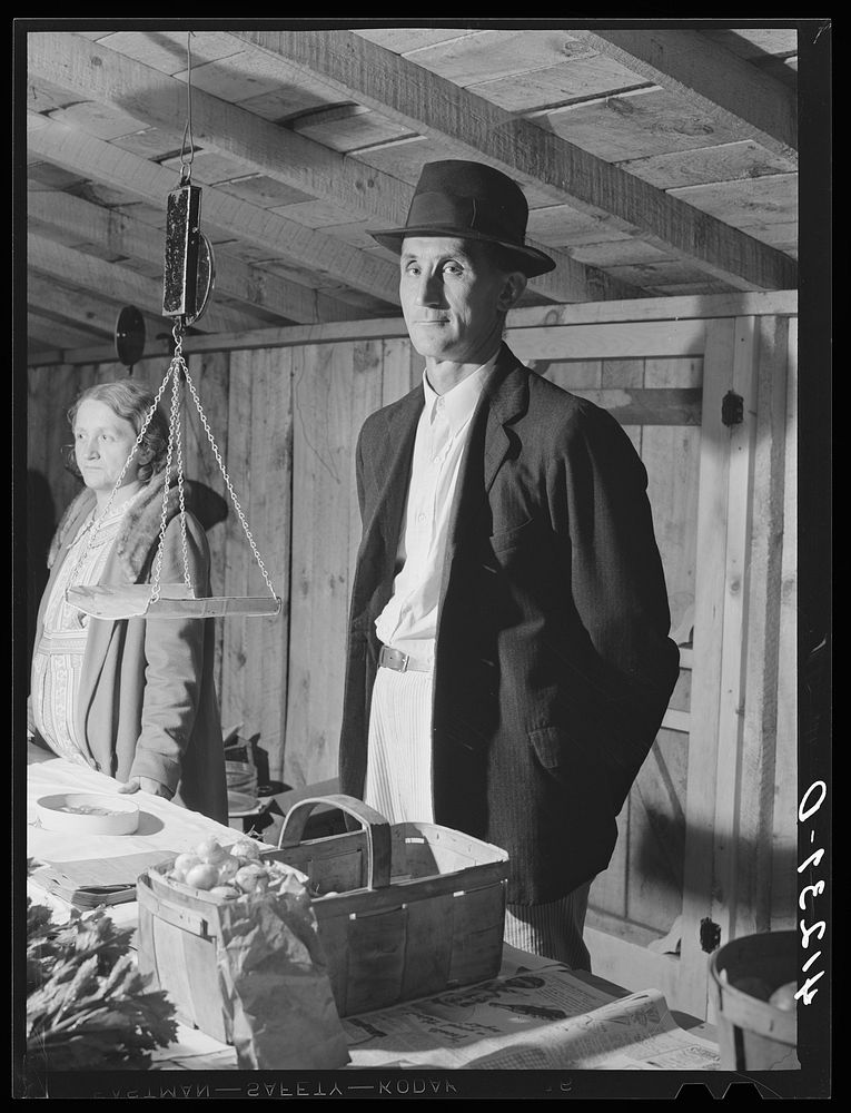 [Untitled photo, possibly related to: Farmer and his wife at their booth in the Tri-County Farmers Co-op Market at Du Bois…