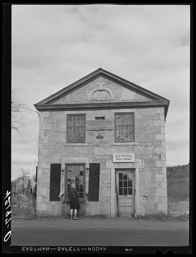 [Untitled photo, possibly related to: Young girl washing windows of post office in Old Mystic, Connecticut]. Sourced from…