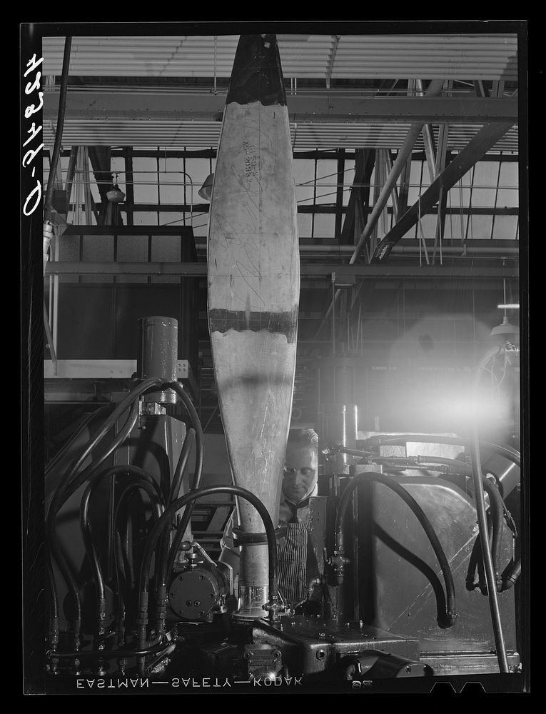 Finishing the base of a rough cut propeller at the Hamilton Standard Propeller Corporation. East Hartford, Connecticut.…