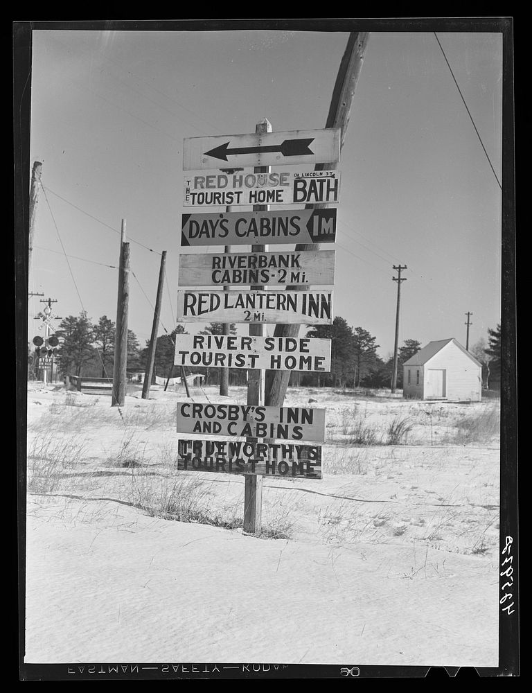 A sign about two miles outside Bath, Maine. Although many of the tourist cabins were only used during the summer months…